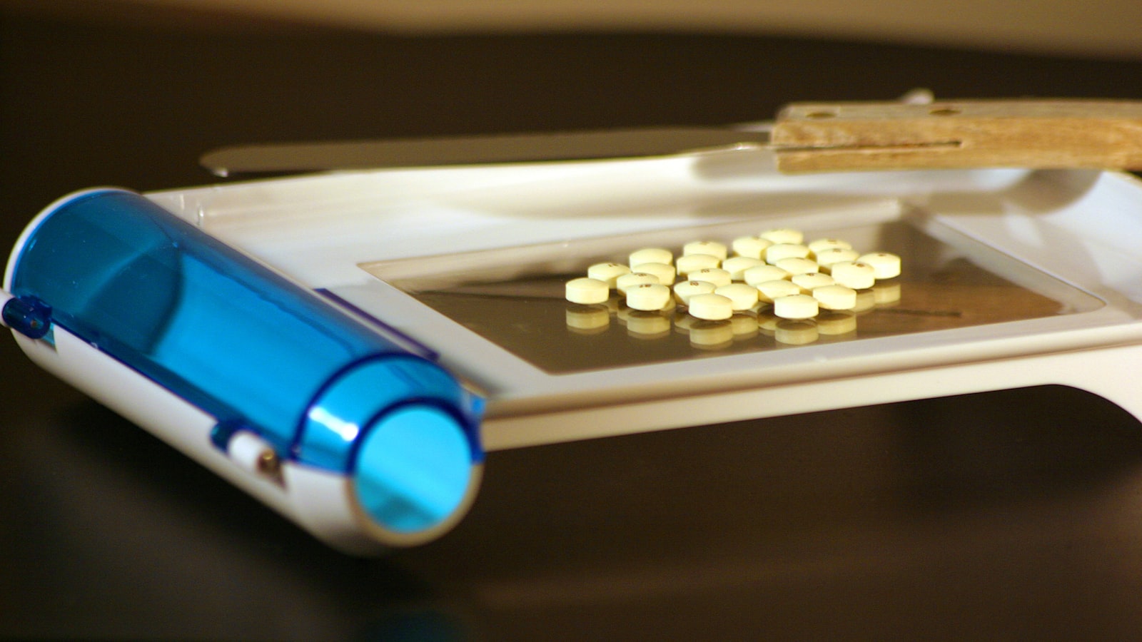 a close-up of a syringe and pills